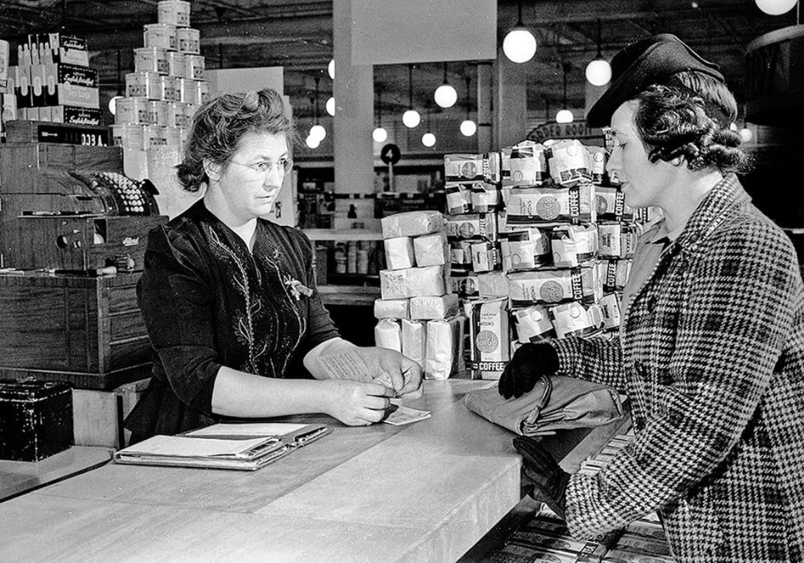 Woman buying food with ration book