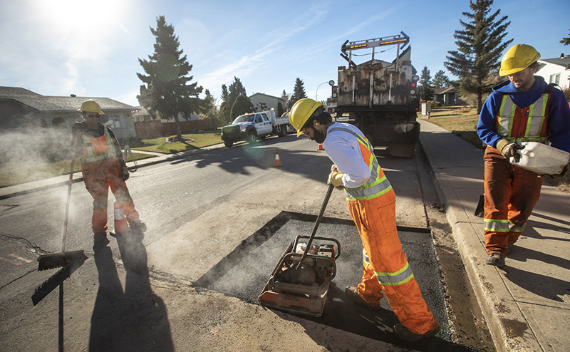 A crew repairing a road