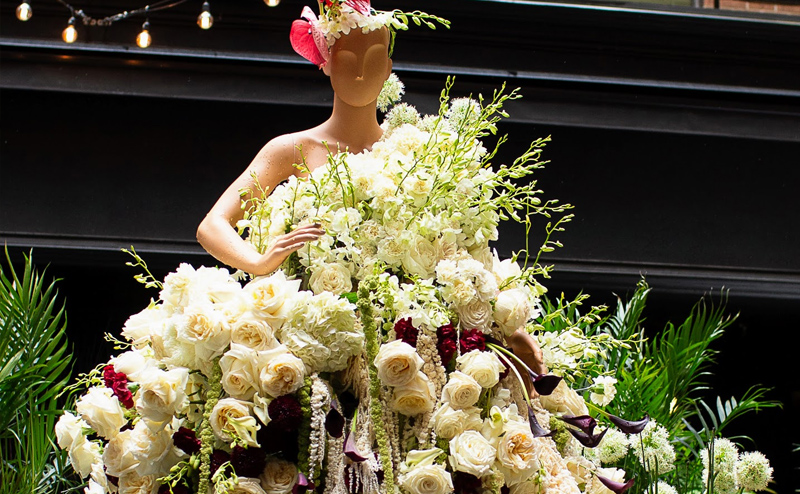 Mannequin wearing flowers.