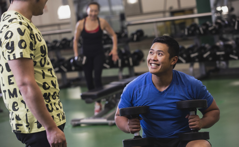 persons of diverse abilities using weights in gym
