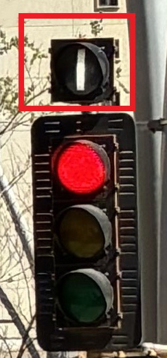 An eastbound curbside queue jump lane on Jasper Avenue at 100A Street, a bus advanced signal (I-light) facilitates the queue jump.