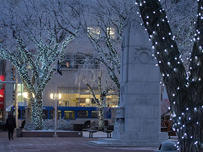 City Hall during winter lit up with tree lights.