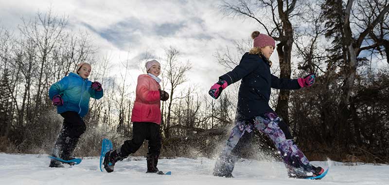 Kids snowshoeing at the Northeast River Valley park