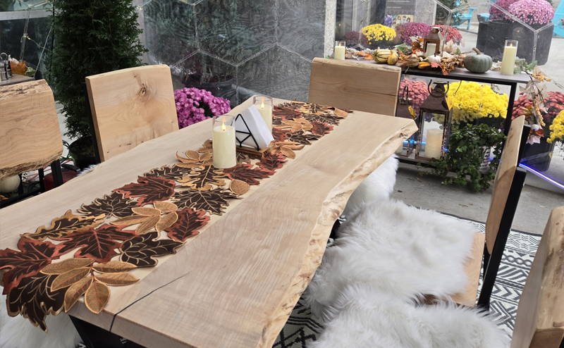 Table and chairs inside the dome, decorated with a fall/winter theme.