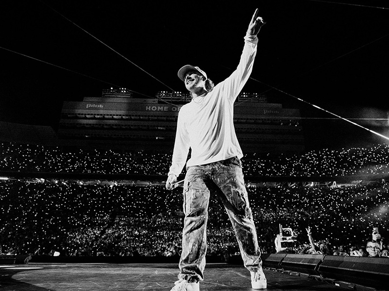 performer on stage in large arena