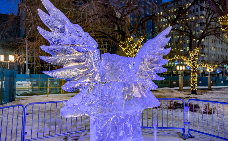 The owl ice carving lit up with blue light