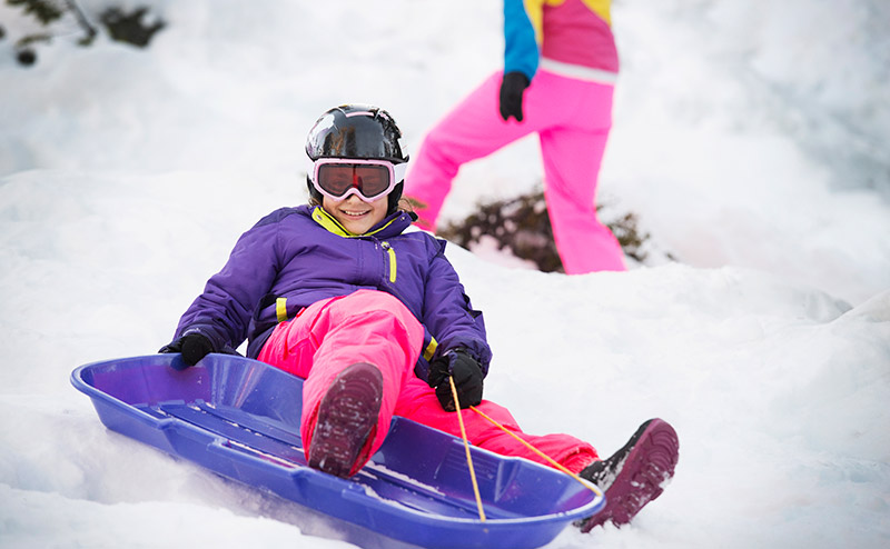 People tobogganing