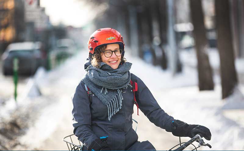 Woman cycling in winter
