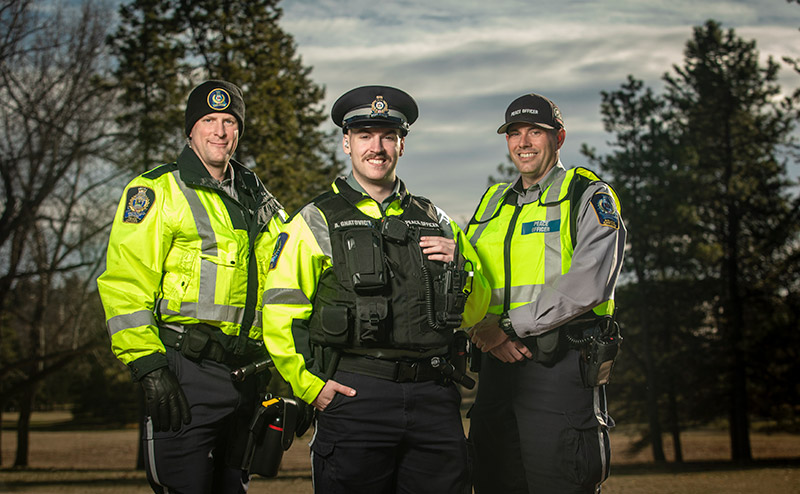 3 peace officers standing in uniform