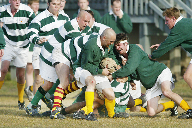 rugby players tackling each other
