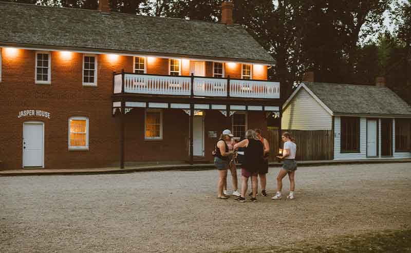 group of people on a street at fort edmonton park