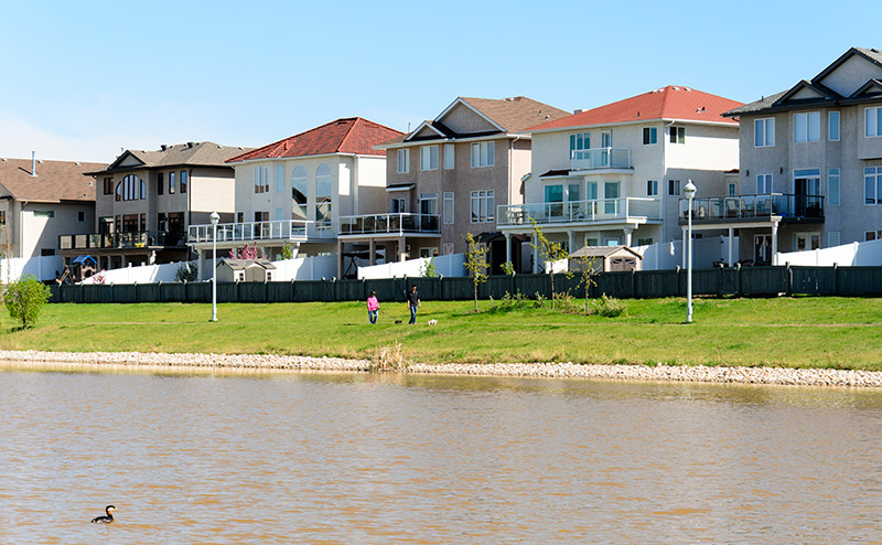 Houses backing onto a runoff lake