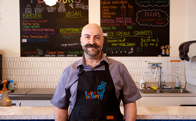 adult person standing in coffee shop
