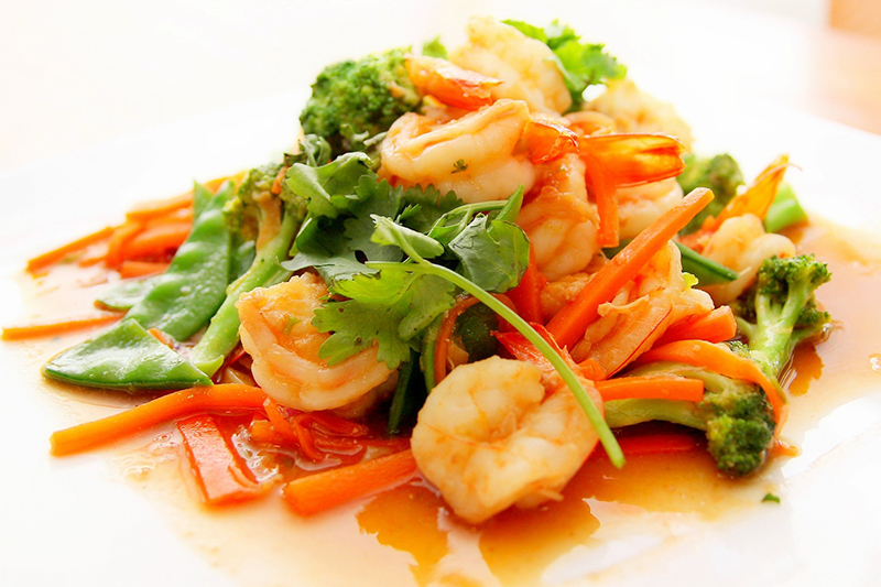 Close up of a shrimp dish with broccoli