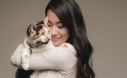 woman holding cat