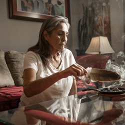 person smudging at home