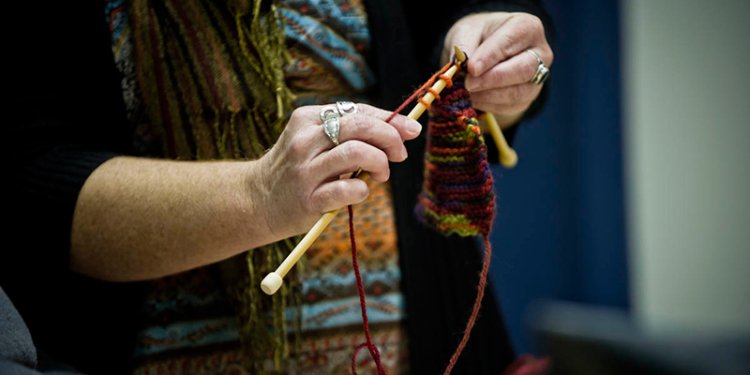 person doing knitting
