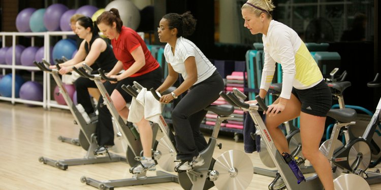people riding bikes in spinning class