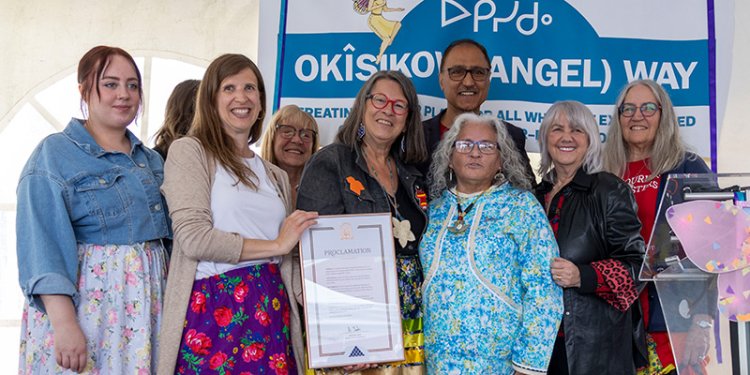 group of people standing with indigenous proclamation