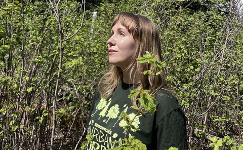 photo of persons standing in forest