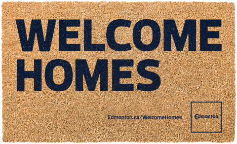 A doormat with the words "Welcome Homes" in large lettering, with the Welcome Homes URL, and the City of Edmonton logo.