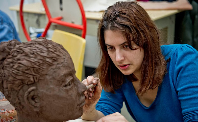 lady painting sculpture