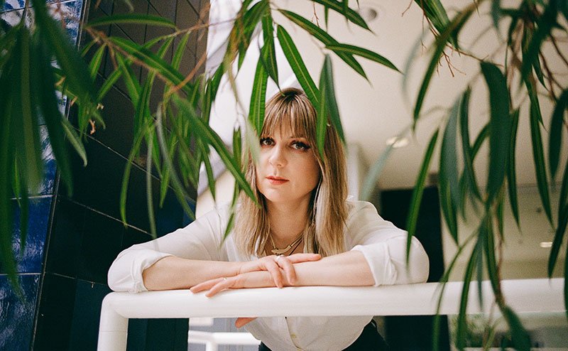 person standing among flowers