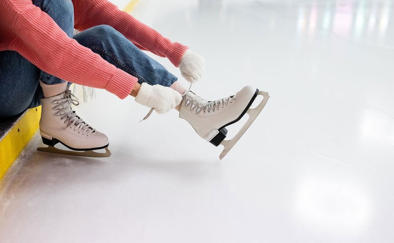 person tying skate