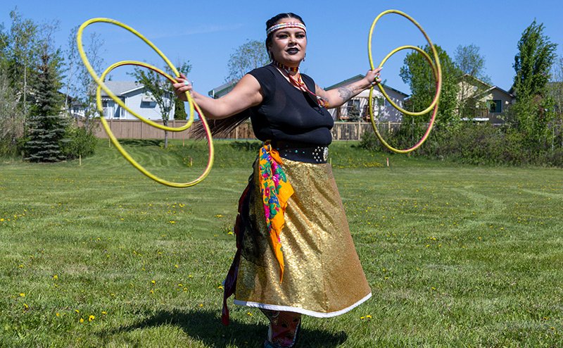 indigenous dancer with hoop