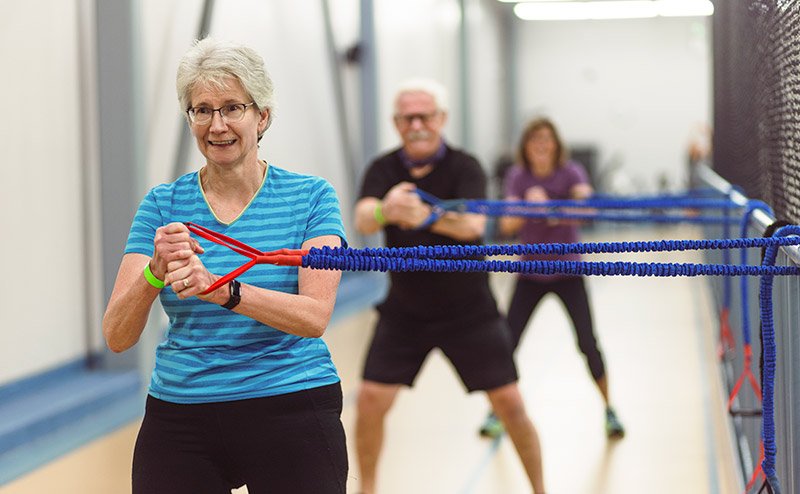 seniors using hand exercise equipment