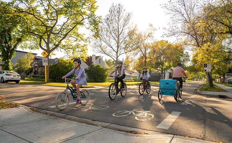 Cyclists pass each other on a bike lane