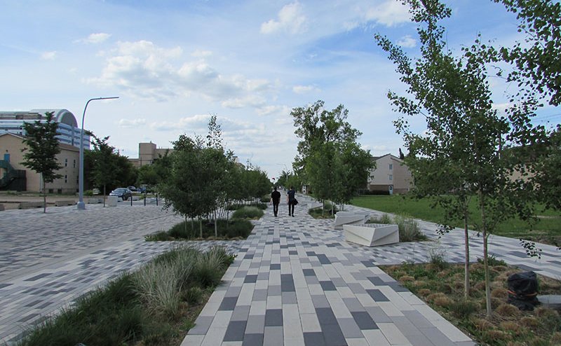 Two people walking in the Armature area of The Quarters