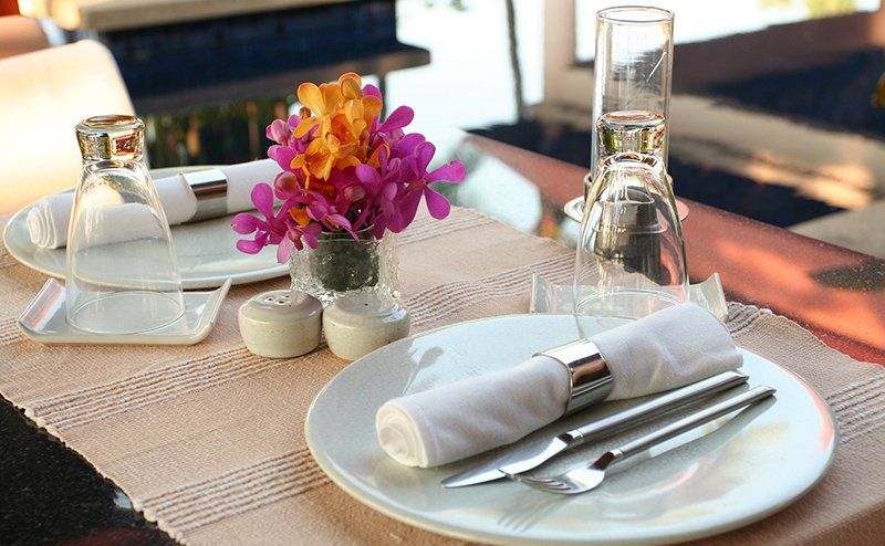 Photo of a table with place settings for a party.
