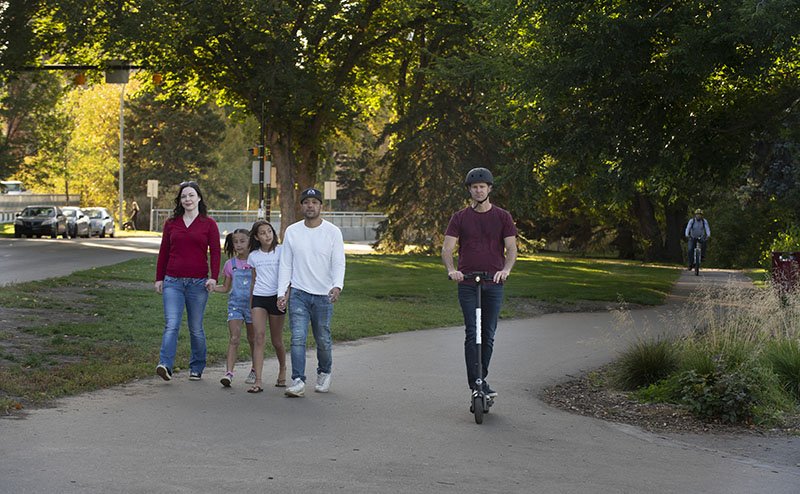 family strolling in park