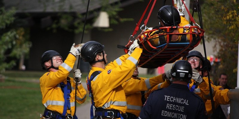firefighters bringing stretcher down